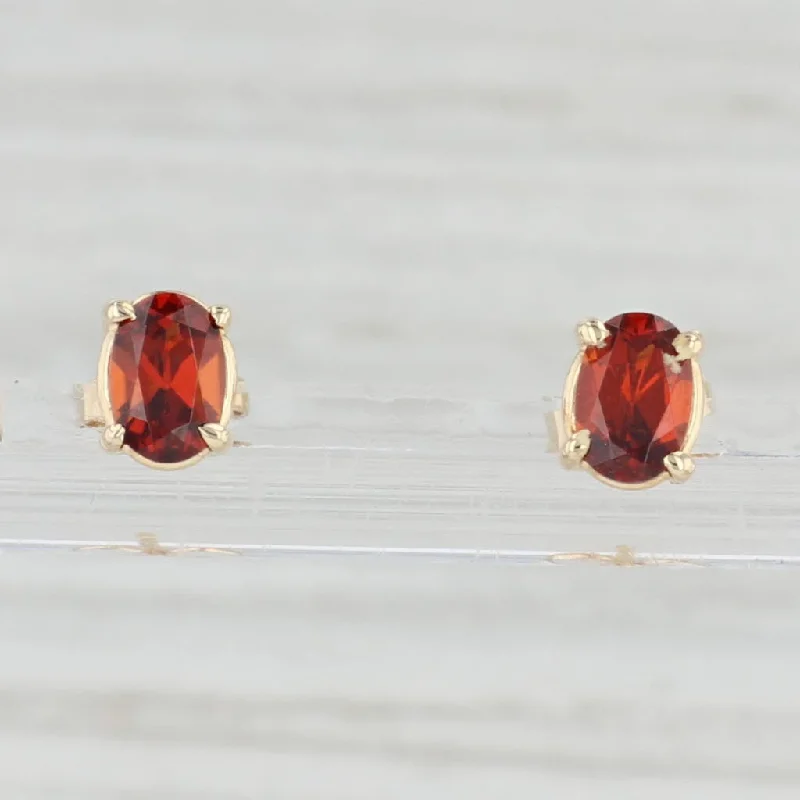 women's earrings with artistic design -1.20ctw Oval Garnet Stud Earrings 14k Yellow Gold January Birthstone