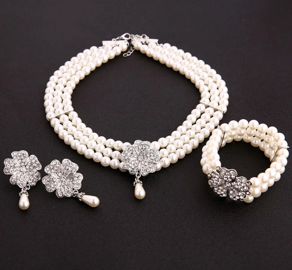 women's bracelets with antique finish -Fashion Flower Artificial Pearl Inlay Artificial Gemstones Women's Bracelets Earrings Necklace