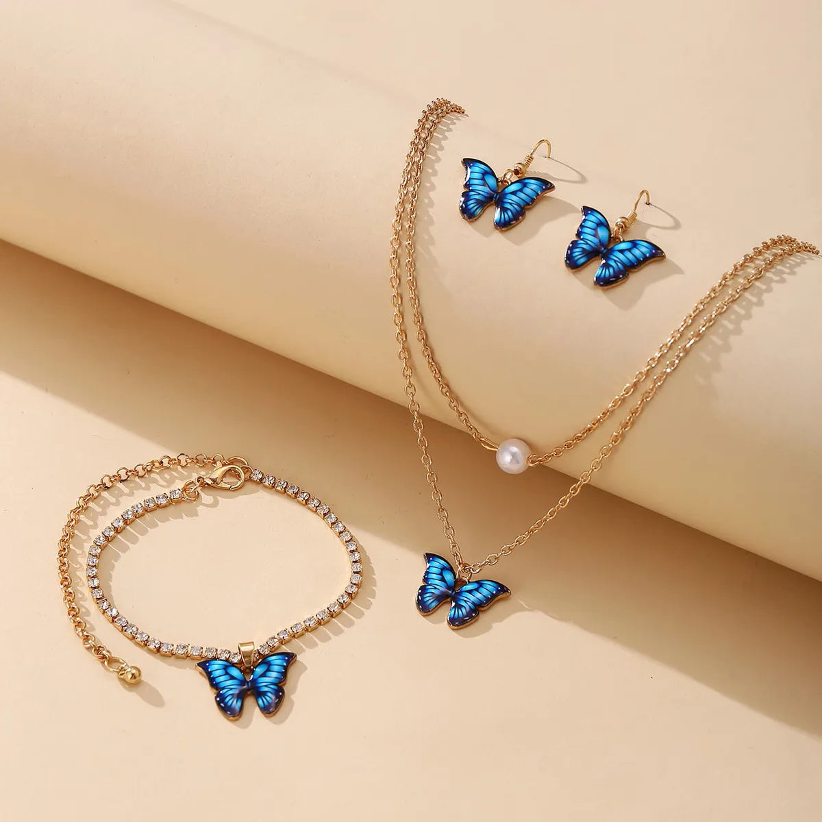 women's bracelets with stacked design -Butterfly Pendant Set 3-piece Creative Earrings Necklace Bracelet Alloy Combination Set